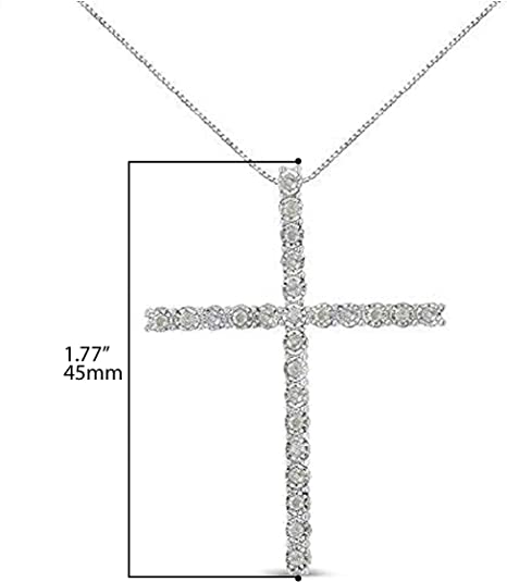 Front view of a white metal necklace with a cross pendant set with round white gemstones, displayed on a ruler for size reference.