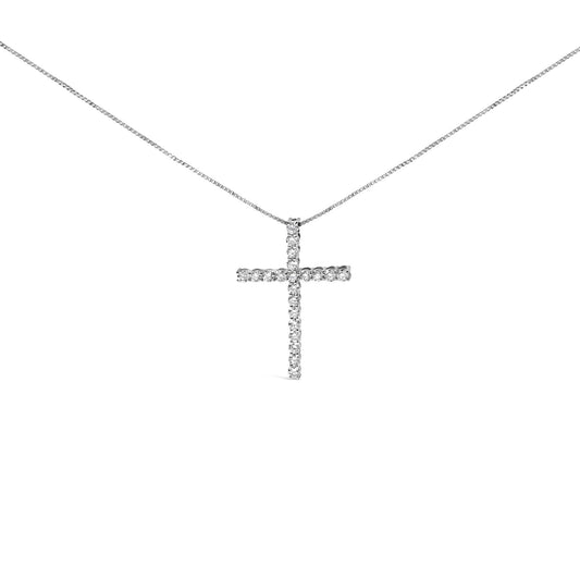 Front angle view of a white metal necklace with a cross pendant set with round white gemstones in a prong setting.