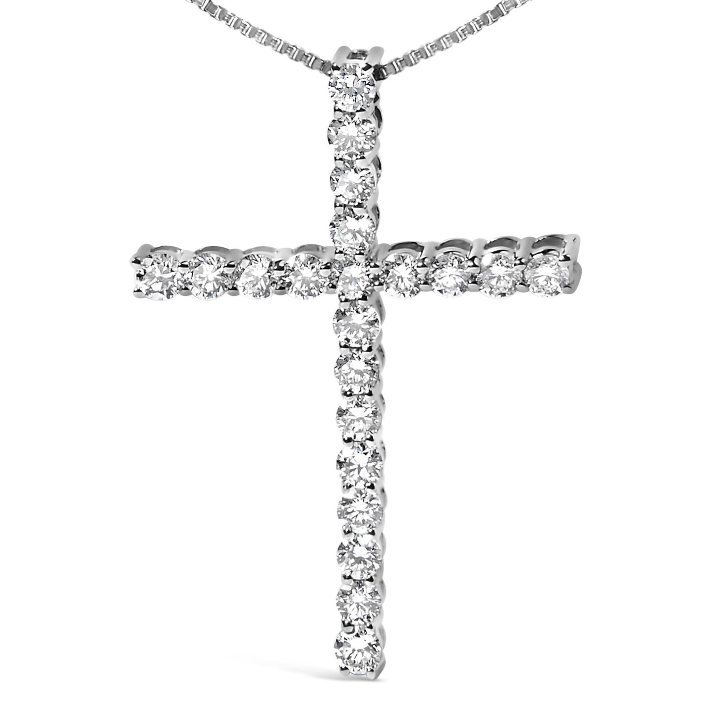 Front angle shot of a white metal cross-shaped necklace pendant featuring prong-set round white gemstones.
