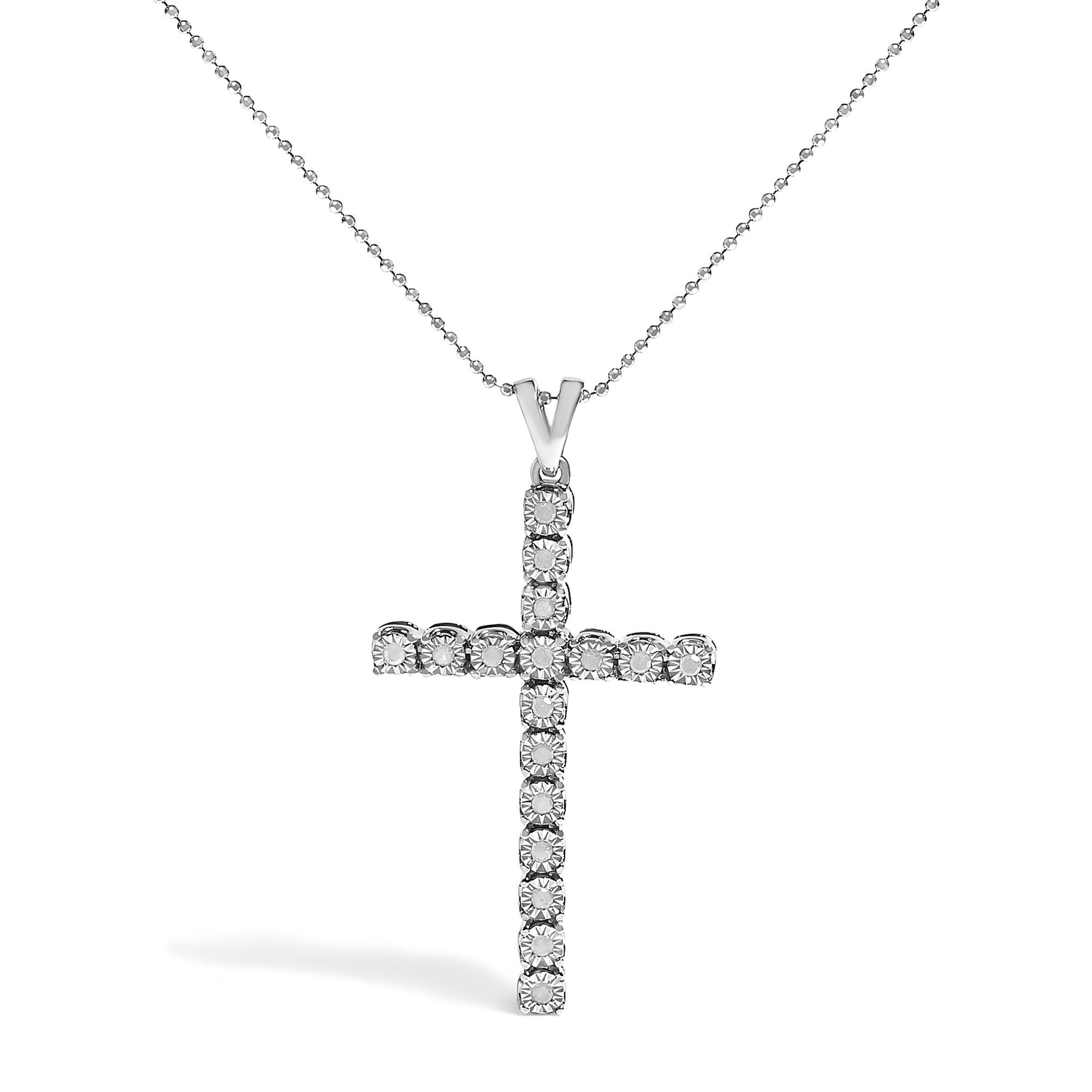 Front view of a white metal cross necklace pendant with round white gemstones in a miracle setting on a beaded chain.