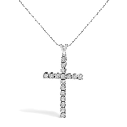 Front view of a white metal cross necklace pendant with round white gemstones in a miracle setting on a beaded chain.