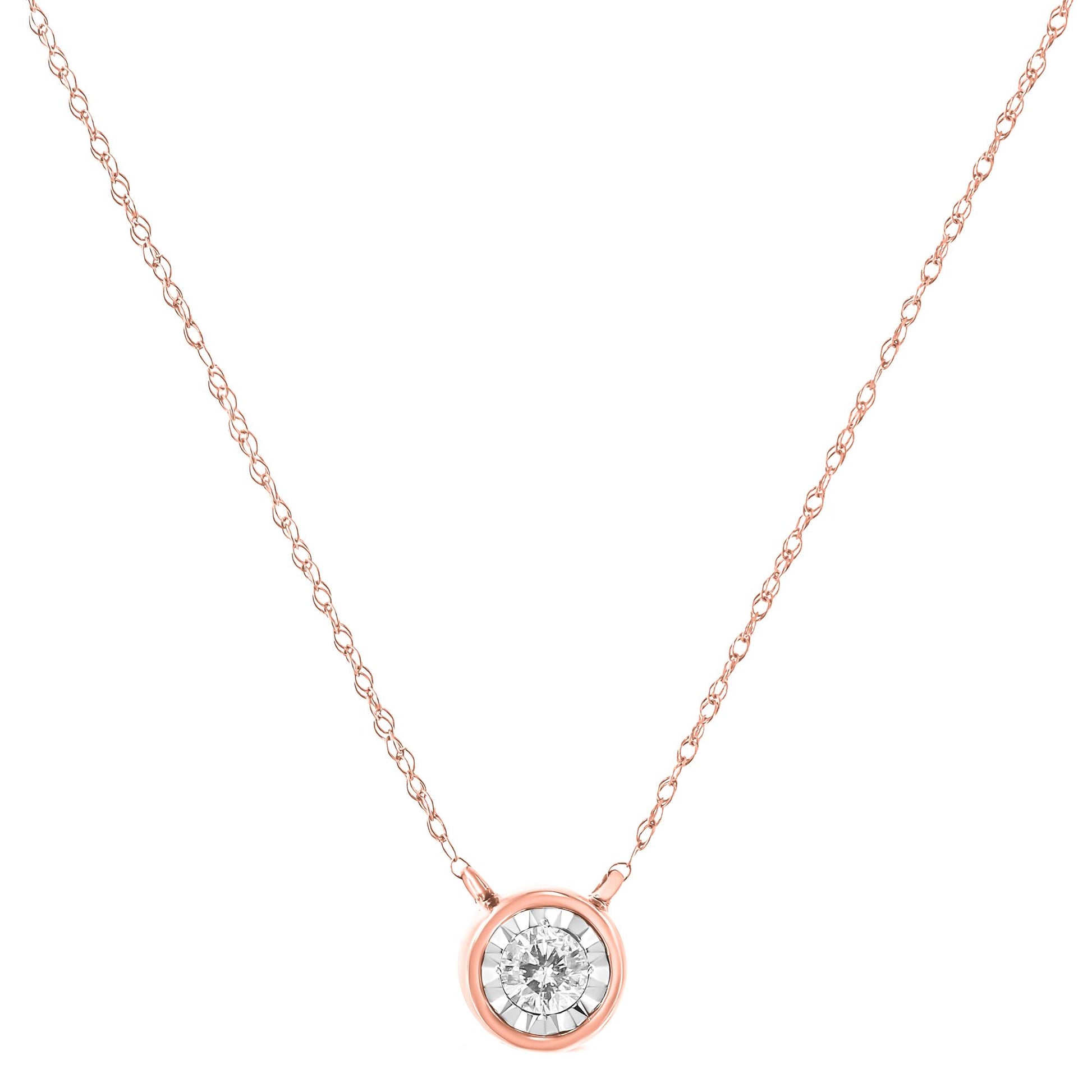 Front-facing view of a rose metal necklace with a single round white gemstone in a miracle setting pendant.