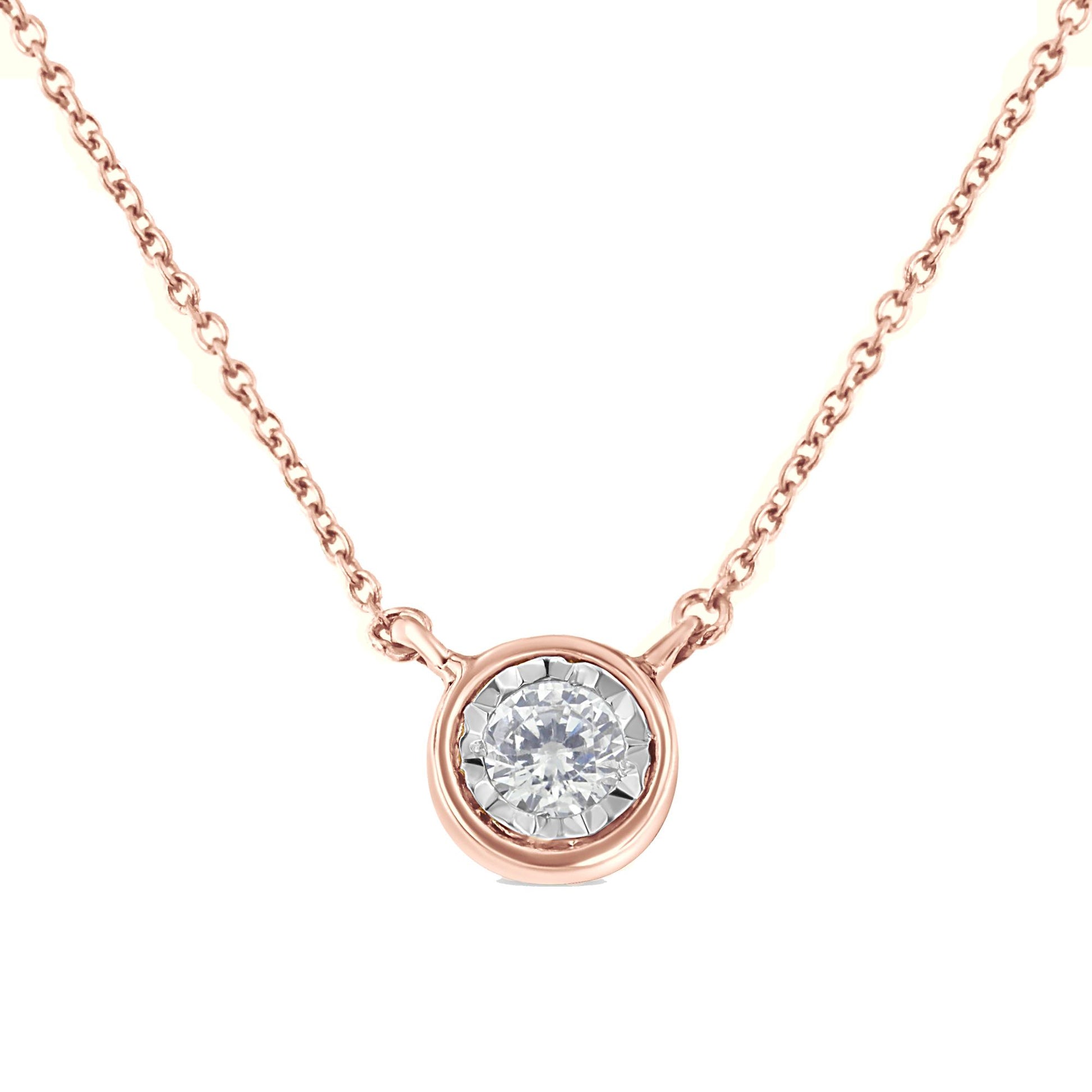 Close-up front view of a rose metal necklace featuring a round white gemstone in a miracle setting.