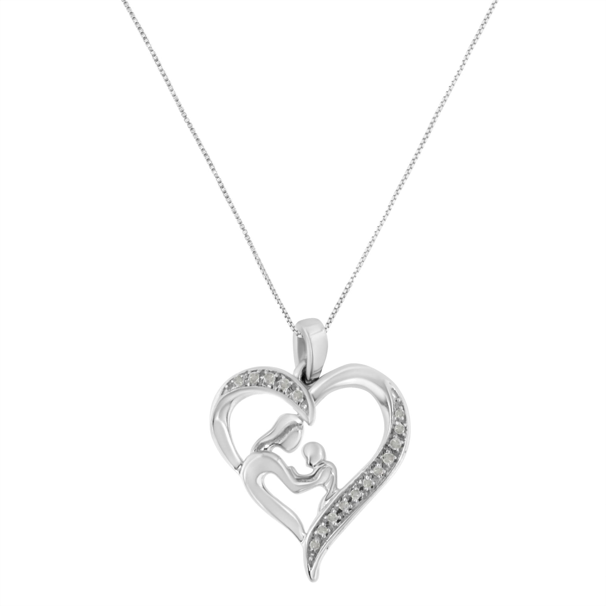 Front-facing shot of a white metal heart-shaped necklace pendant with an abstract mother and child design, accented with round prong-set white gemstones along the heart outline.