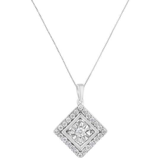 Front angle of white metal necklace with square-shaped pendant featuring a central round gemstone in miracle setting surrounded by rows of round gemstones in prong settings.