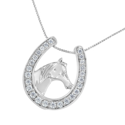 White metal necklace photographed from the front featuring a horseshoe pendant with a horse head inside, the horseshoe is set with round white gemstones in prong settings.