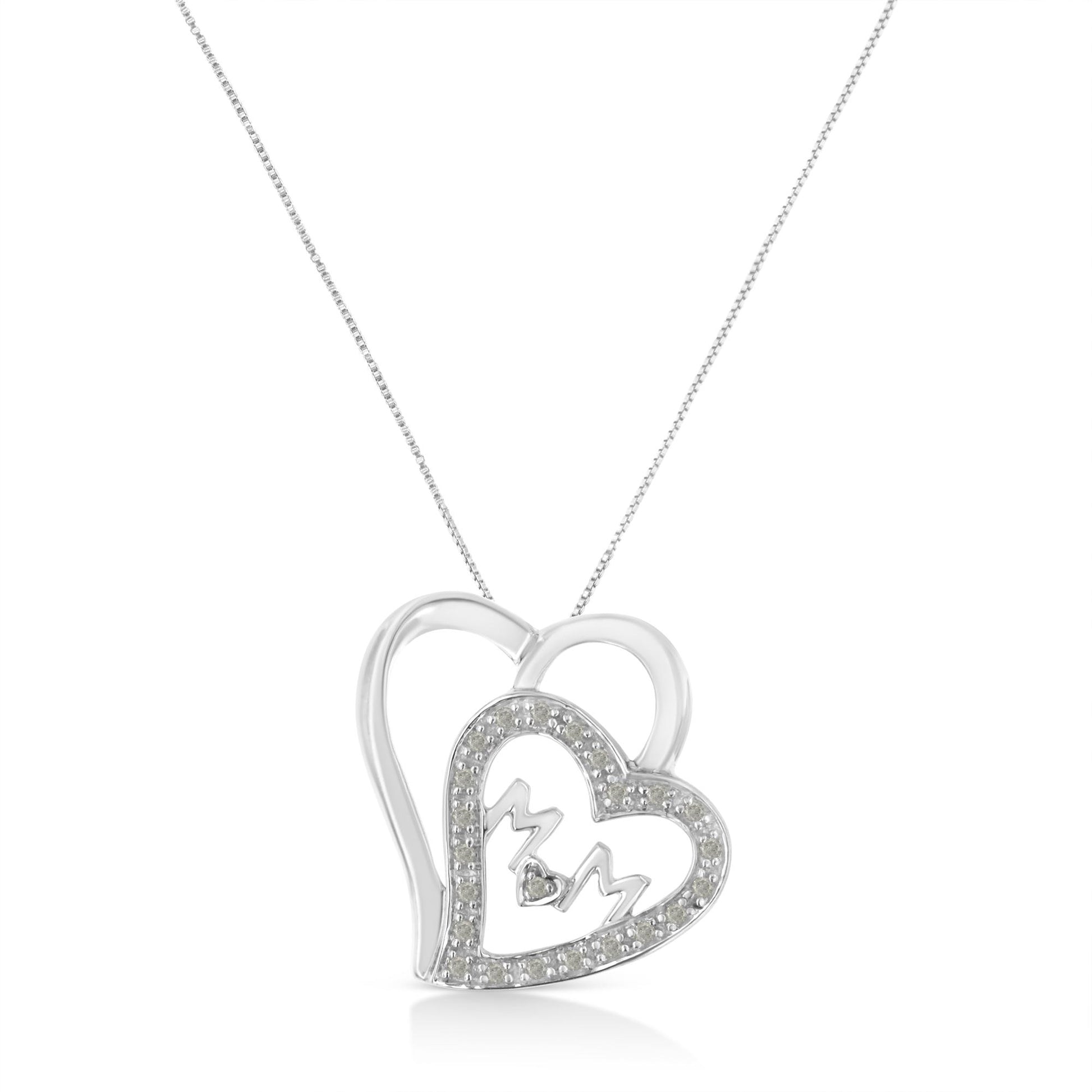 Front view of a white metal heart-shaped necklace pendant with another heart outline set with round white gemstones and the letters 'M' and 'M' inside, hanging from a chain.