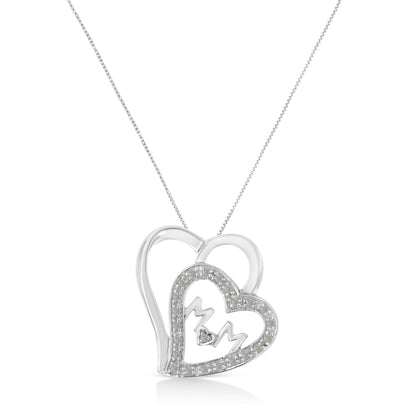 Front view of a white metal heart-shaped necklace pendant with another heart outline set with round white gemstones and the letters 'M' and 'M' inside, hanging from a chain.