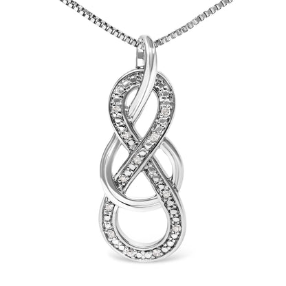 Close-up front view of a white metal necklace with an intertwined pendant accented with round prong-set white gemstones.