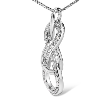 Close-up front angle of a white metal necklace pendant featuring an intertwined loop design with round white gemstones in prong settings along the curves.