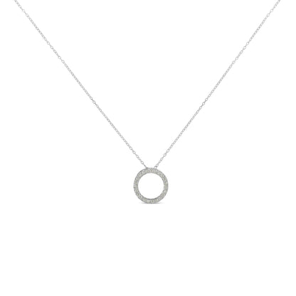 Front view of a white metal necklace with a circular pendant set with round white gemstones in prong settings.