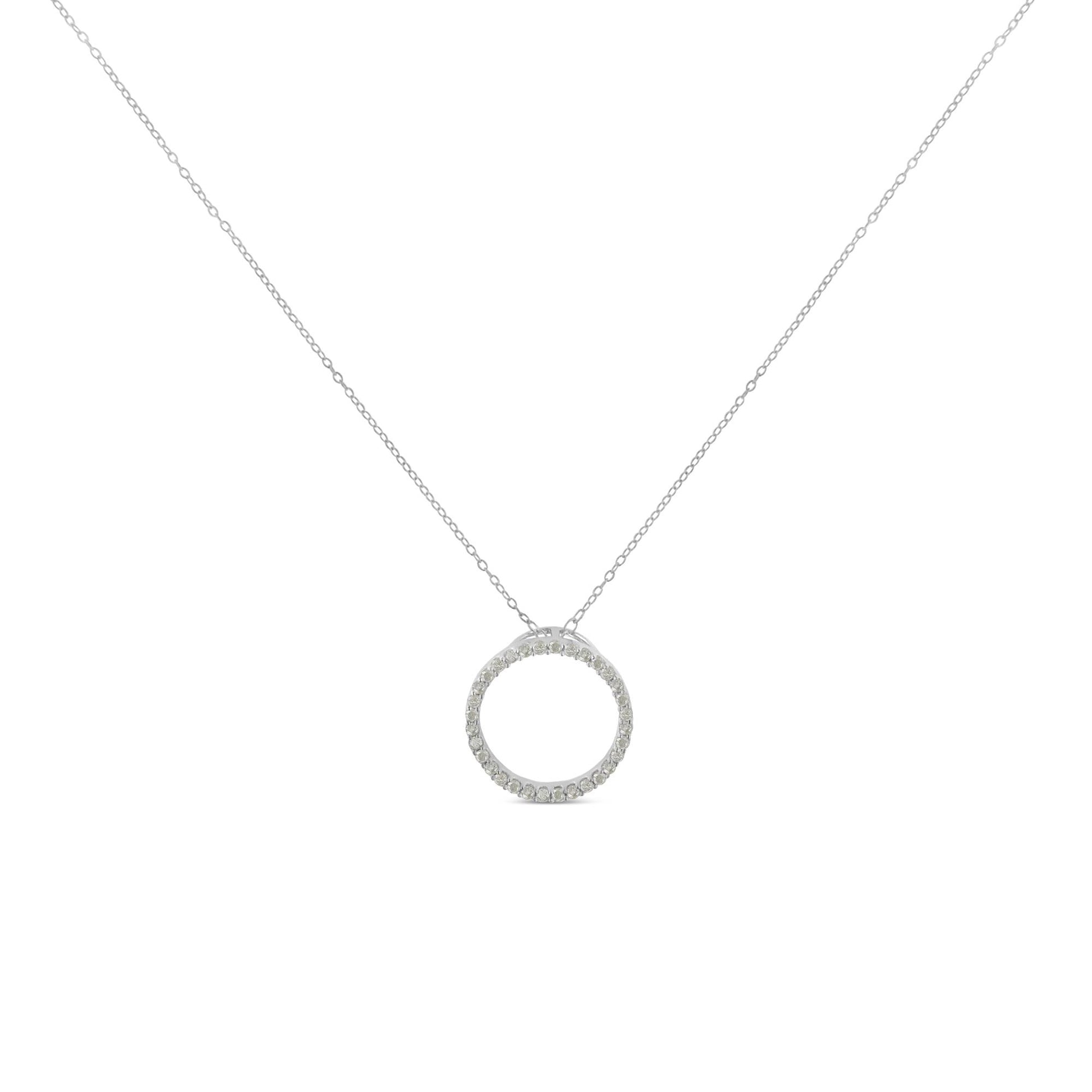 Front view of a white metal necklace with a circular pendant featuring round white gemstones in a pave setting.