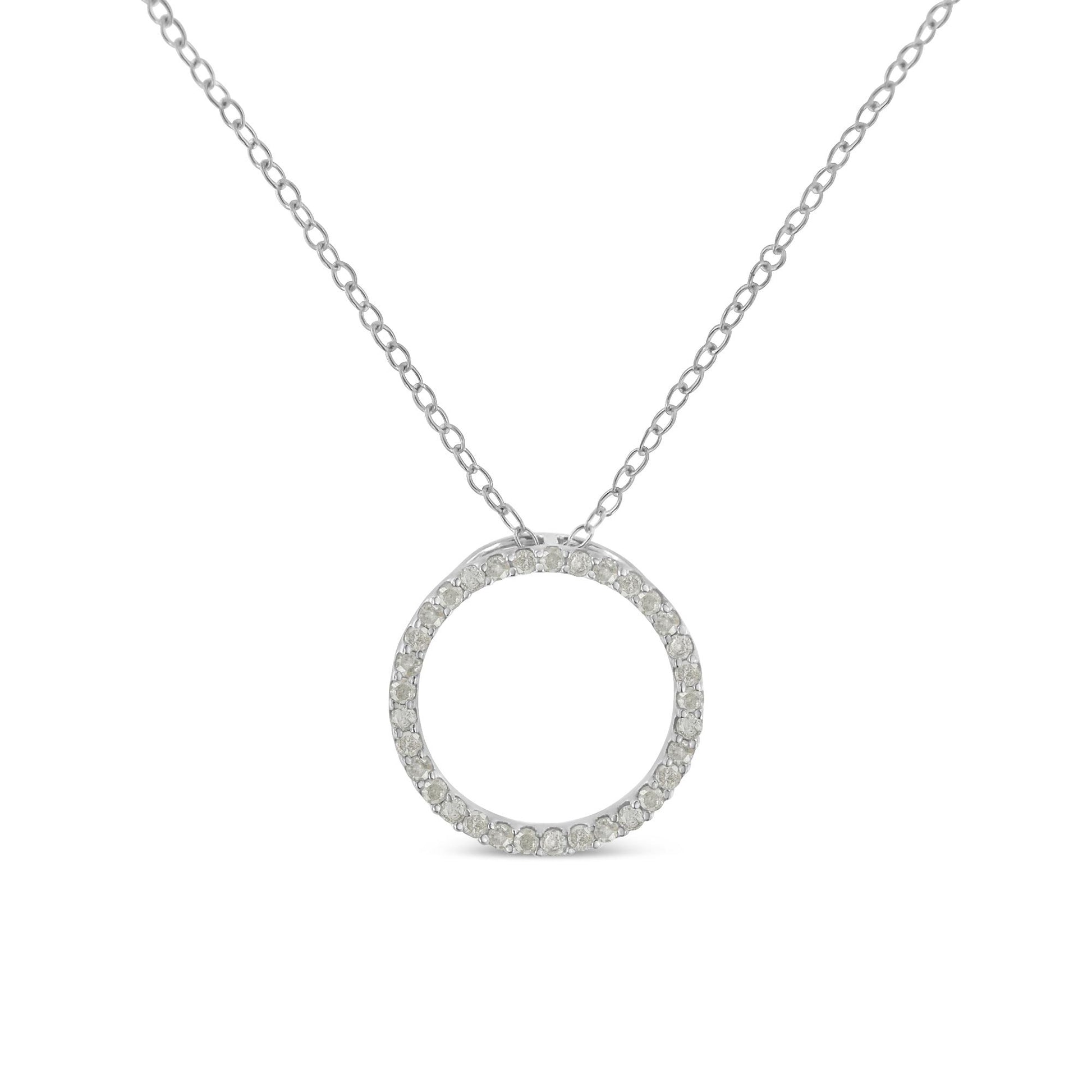 Front view of a white metal necklace with a circular pendant encrusted with round white gemstones in a pave setting.