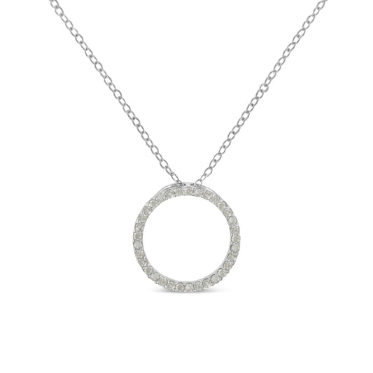 Front view of a white metal necklace with a circular pendant encrusted with round white gemstones in a pave setting.