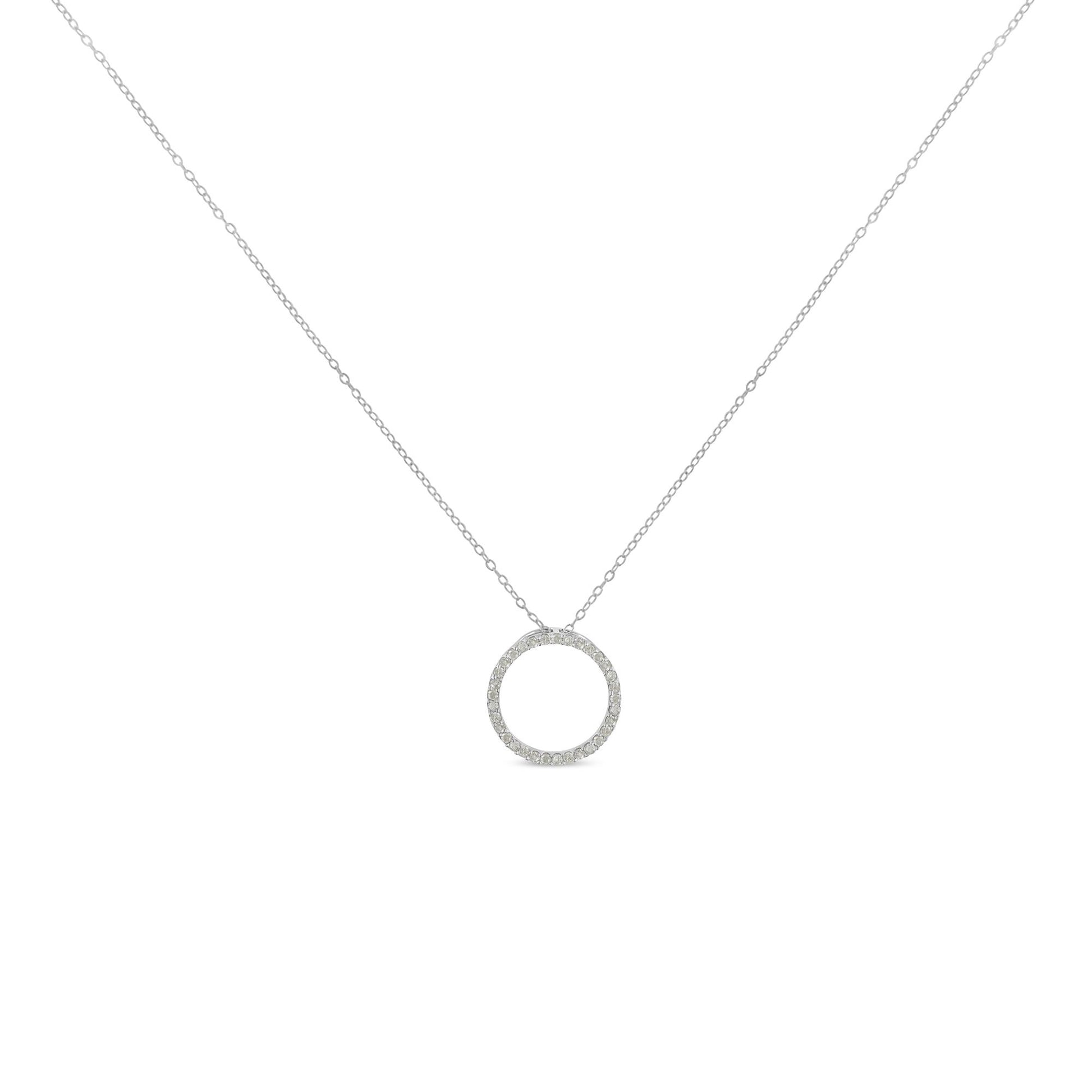 Front view of a white metal necklace with a circular pendant featuring round white gemstones in a pave setting.
