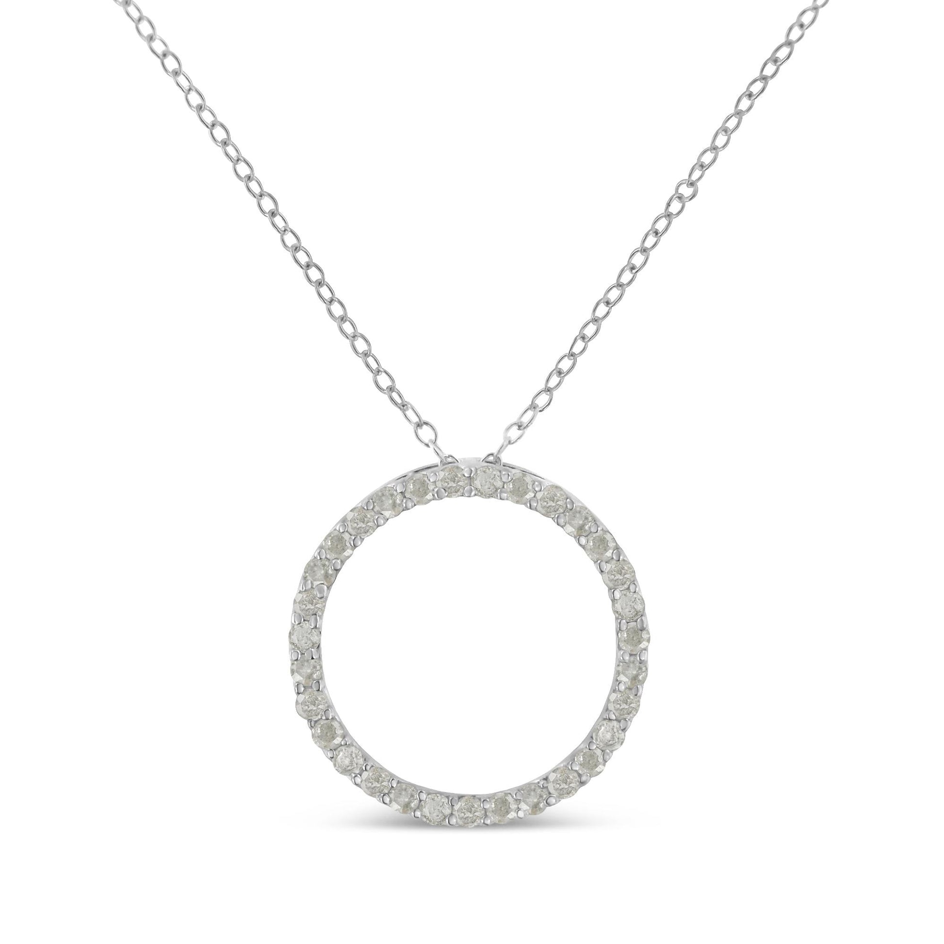 Front view of a white metal necklace with a circular pendant encrusted with round white gemstones in a pave setting.