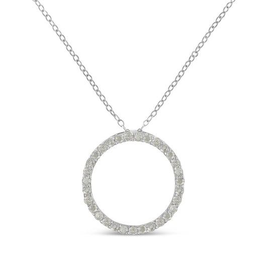 Front view of a white metal necklace with a circular pendant encrusted with round white gemstones in a pave setting.
