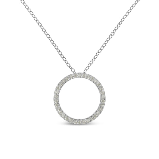 Front-facing close-up of a white metal necklace with a circular pendant paved with round white gemstones.