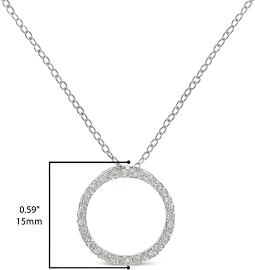 White metal necklace with a circular pendant pave set with round white gemstones, shown front-facing, displayed on a ruler for size reference.