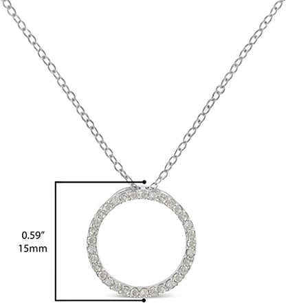 White metal necklace with a circular pendant pave set with round white gemstones, shown front-facing, displayed on a ruler for size reference.
