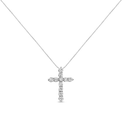Front view of a white metal necklace with a cross pendant featuring round white gemstones in prong settings.