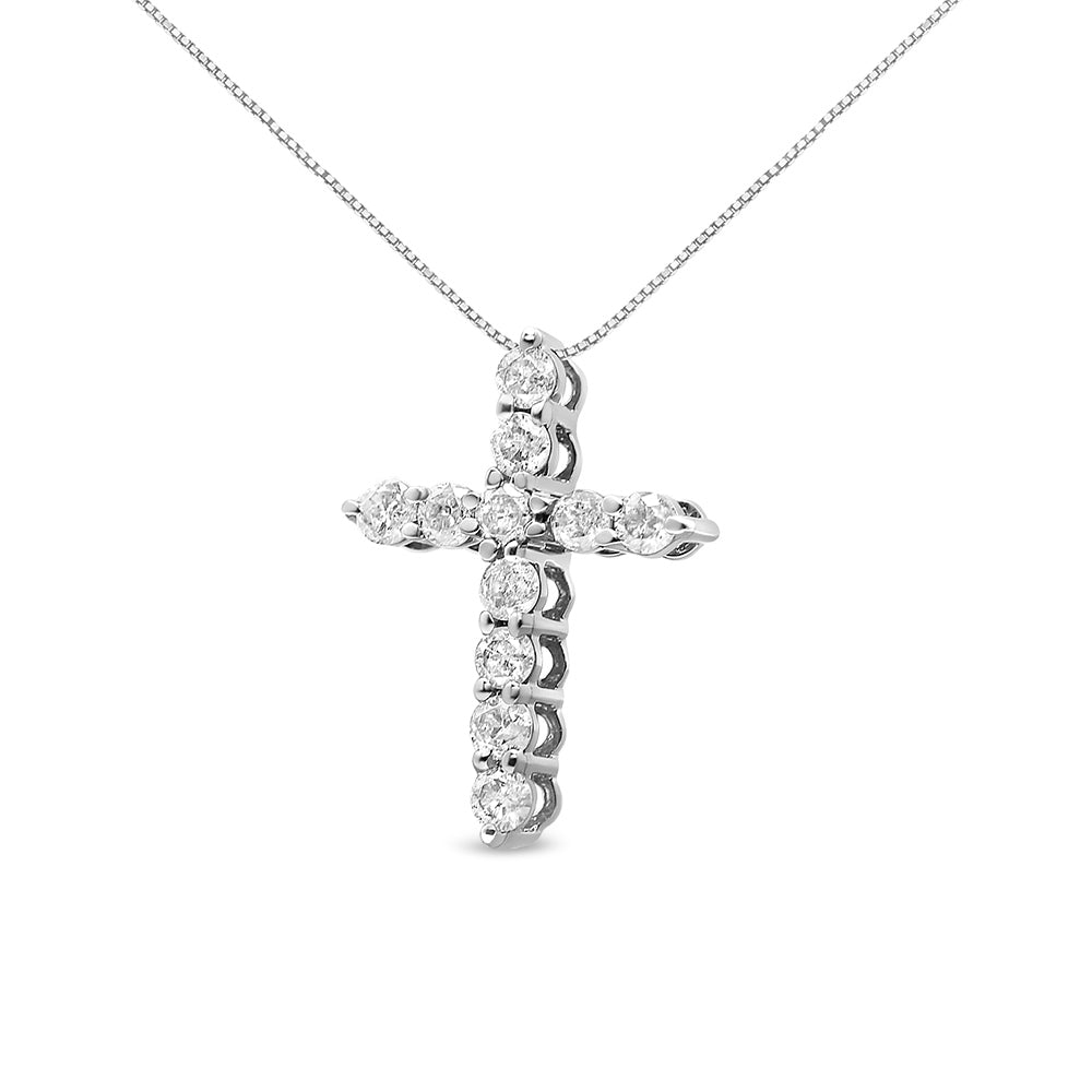 White metal necklace with a cross pendant featuring round white gemstones in prong settings, shown from a slight frontal angle.