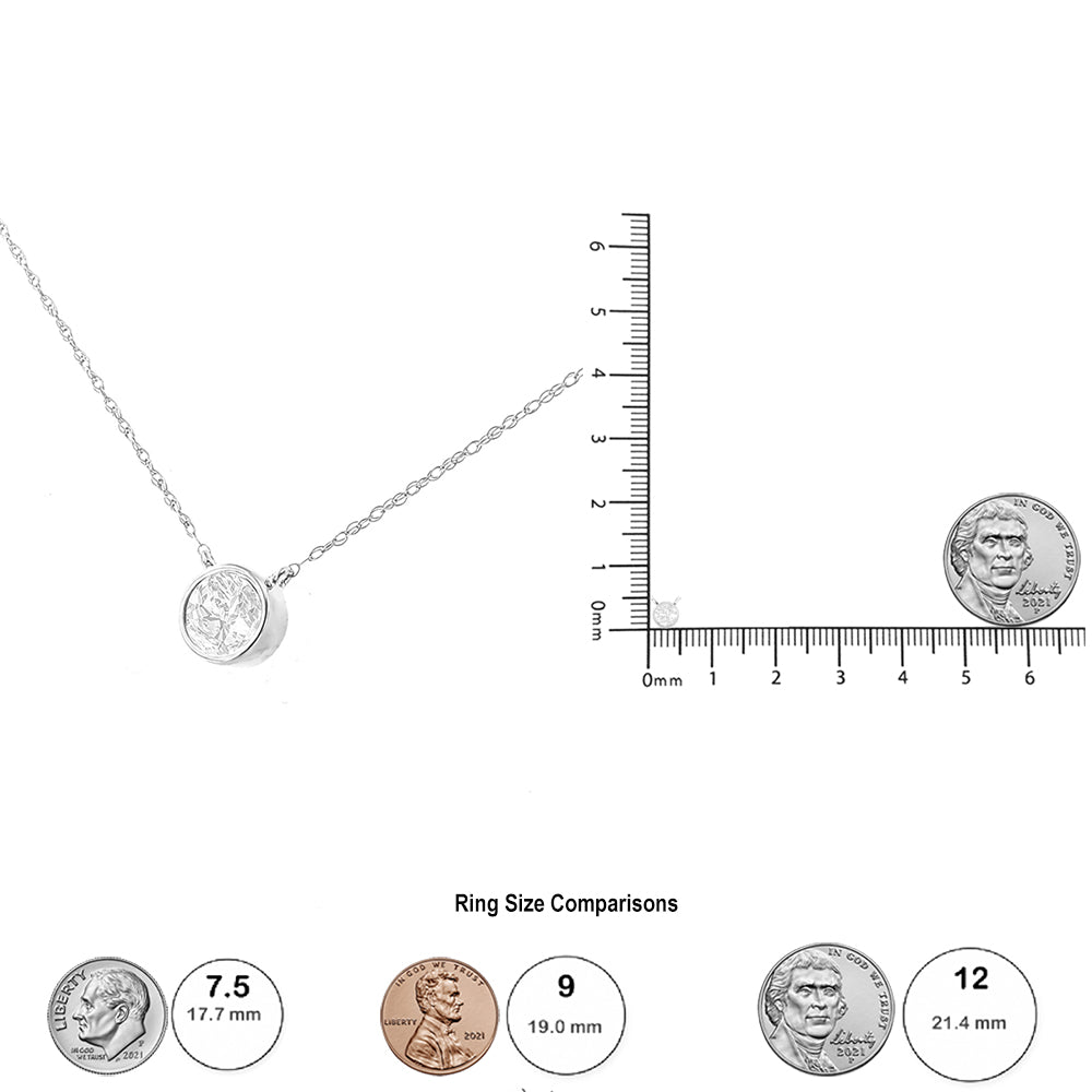 White metal necklace with a round white gemstone in a bezel setting, shown flat next to a ruler and coins for size reference.