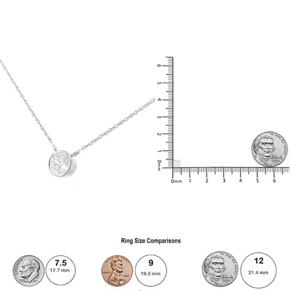 White metal necklace with a round white gemstone in a bezel setting, shown flat next to a ruler and coins for size reference.