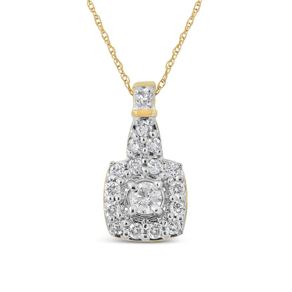 Front-facing shot of a yellow metal necklace with a pendant featuring a central round white gemstone in prong setting surrounded by smaller round white gemstones in both prong and pave settings.