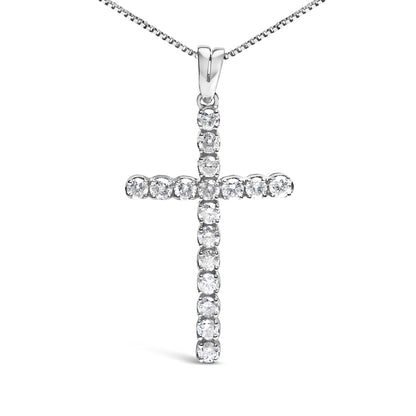 Front-facing shot of a white metal cross necklace pendant with round white gemstones in prong settings.