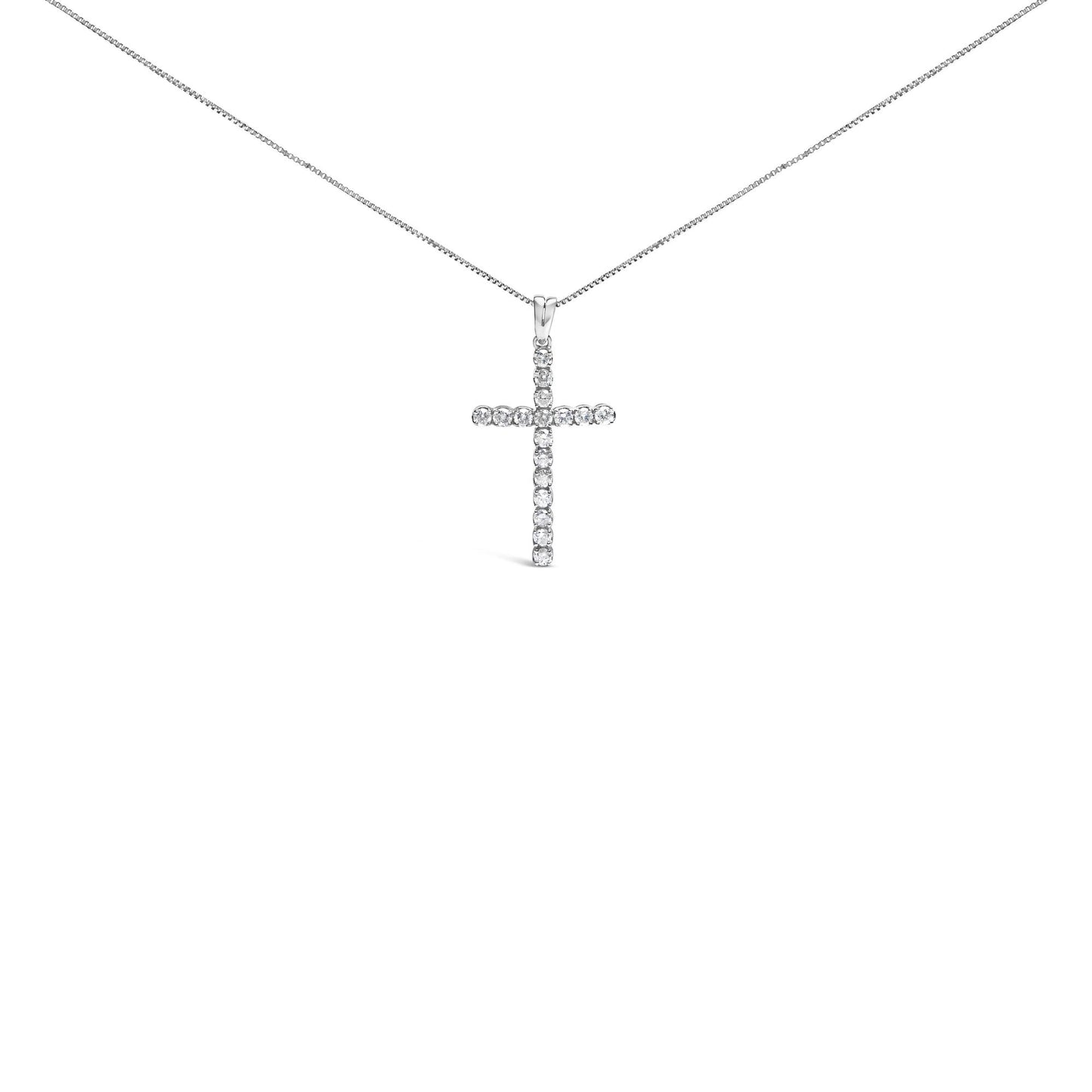 Front facing shot of a white metal necklace with a cross-shaped pendant adorned with round white gemstones in prong settings.