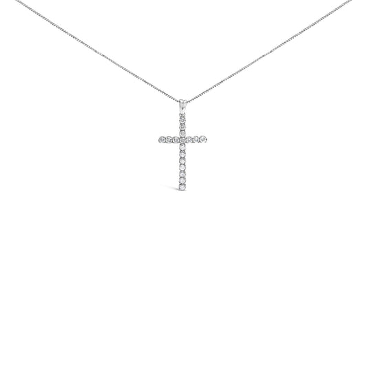 Front facing shot of a white metal necklace with a cross-shaped pendant adorned with round white gemstones in prong settings.