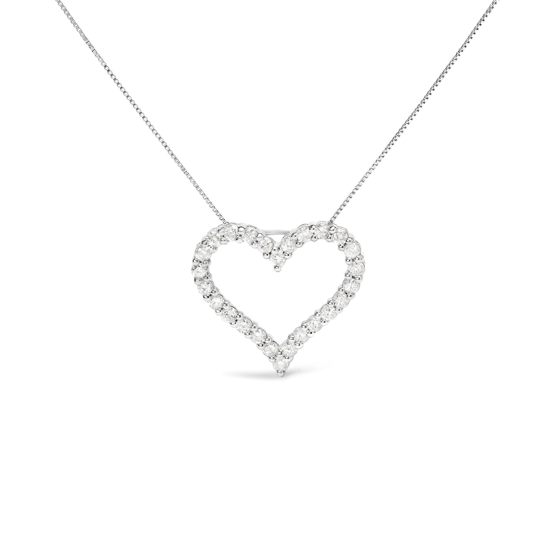 Front view of a white metal heart-shaped necklace pendant with round white gemstones in a shared prong setting on a chain.