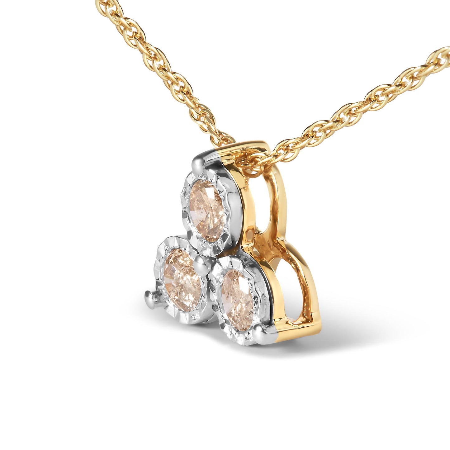 Close-up front angle of a necklace pendant featuring three round white gemstones set in prong settings, with a combination of yellow and white metal.