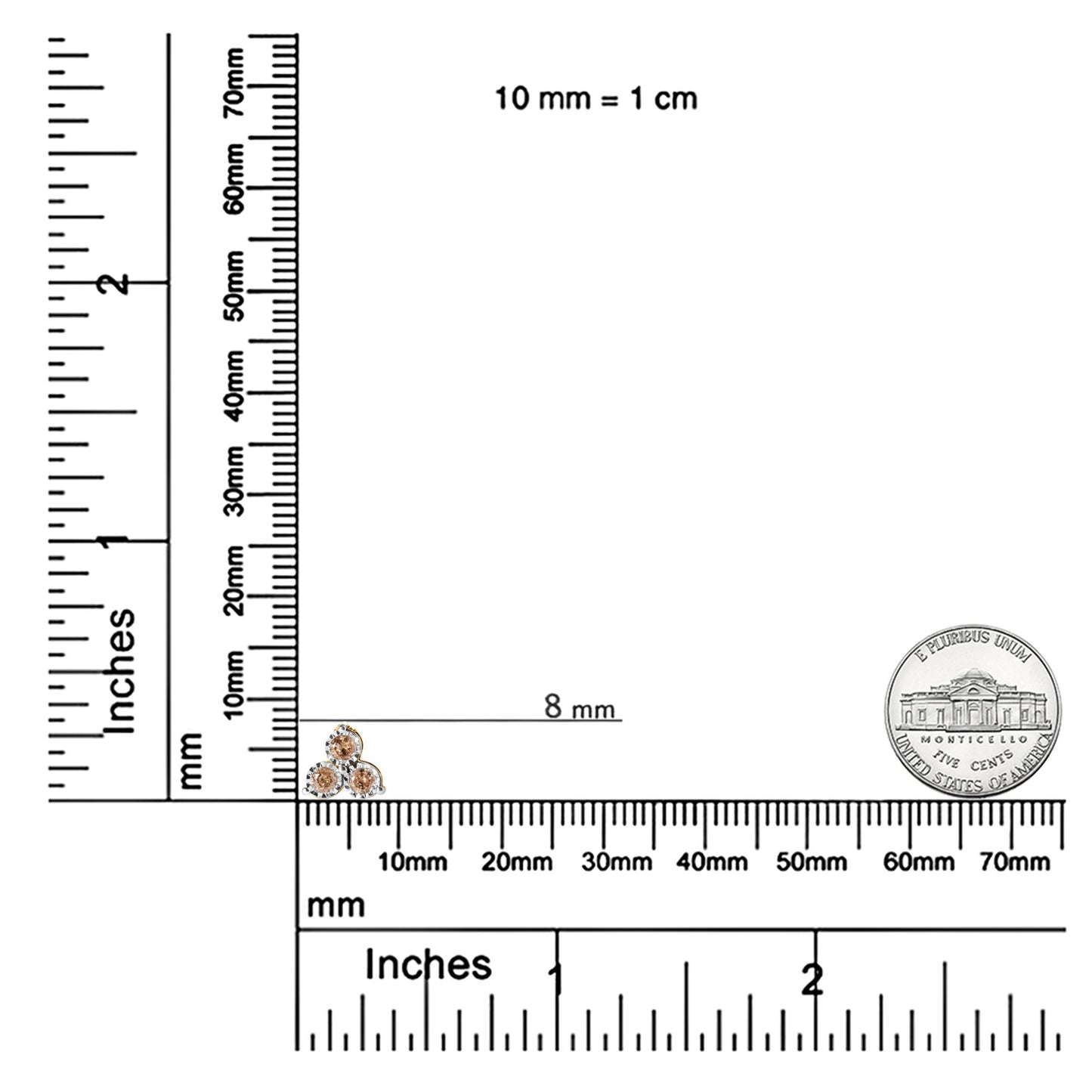 Close-up front angle of a yellow and white metal necklace pendant featuring three round prong-set white gemstones, shown on a ruler and scale for size reference.