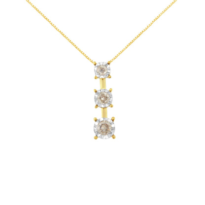 Front view of a yellow and white metal necklace pendant with three vertically aligned round white gemstones in miracle settings.