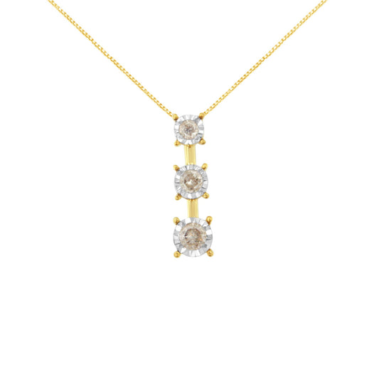 Front view of a yellow and white metal necklace pendant with three vertically aligned round white gemstones in miracle settings.