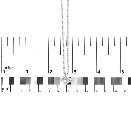 White metal necklace with a princess-shaped white gemstone in bezel setting, photographed from above on a ruler for size reference.