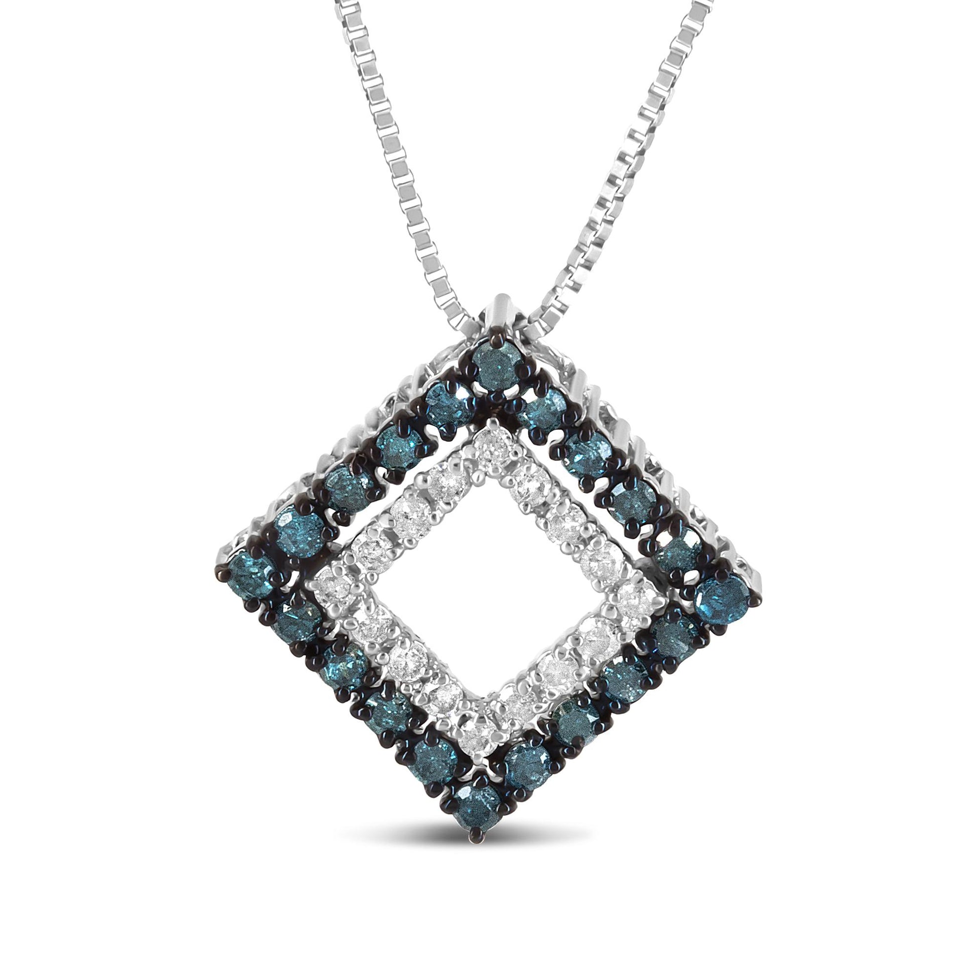 Close-up front view of a white metal necklace pendant featuring two square frames, the inner set with white gemstones and the outer set with blue gemstones, both in prong settings.