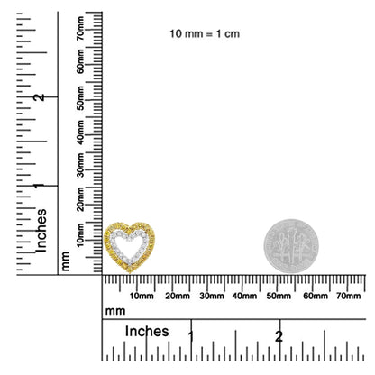 Close-up front view of a heart-shaped necklace pendant with yellow and white round gemstones in two prong settings, shown on a ruler for size reference.