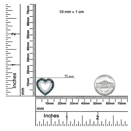 White metal heart-shaped necklace pendant with round blue and white gemstones in prong settings, shown from front on a ruler and scale for size reference.