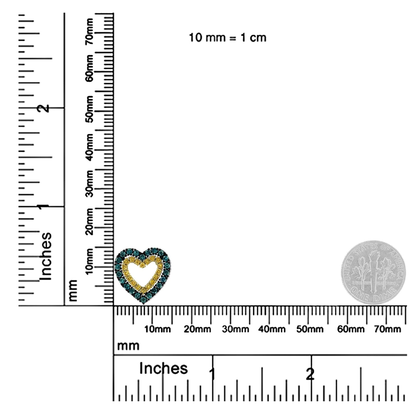 Close-up front angle of a yellow metal heart-shaped necklace pendant with yellow and blue round prong-set gemstones, shown on a ruler and scale for size reference.
