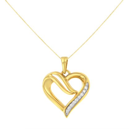 Front view of a yellow metal heart-shaped necklace pendant with a diagonal row of round white gemstones in prong settings.