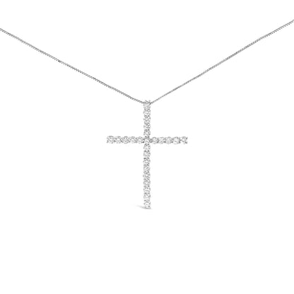 Front view of a white metal cross-shaped necklace pendant adorned with round prong-set white gemstones on a white metal chain.