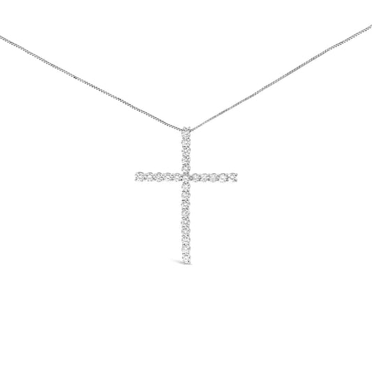 Front view of a white metal cross-shaped necklace pendant adorned with round prong-set white gemstones on a white metal chain.