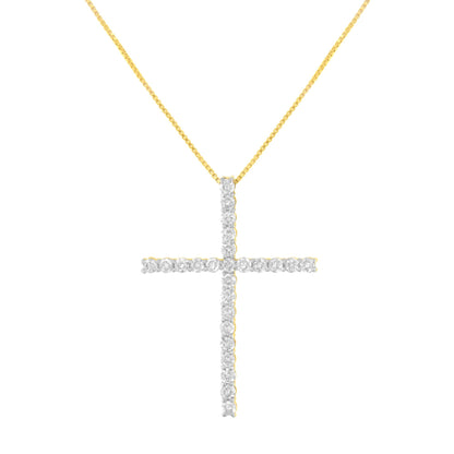 Front-facing shot of a yellow metal cross pendant necklace with round white gemstones in prong settings.