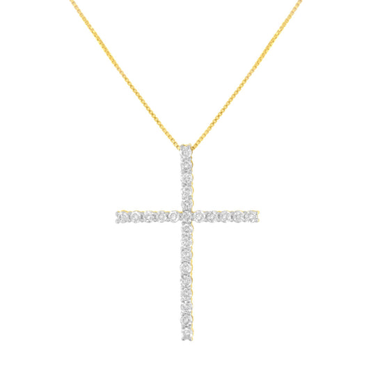 Front-facing shot of a yellow metal cross pendant necklace with round white gemstones in prong settings.