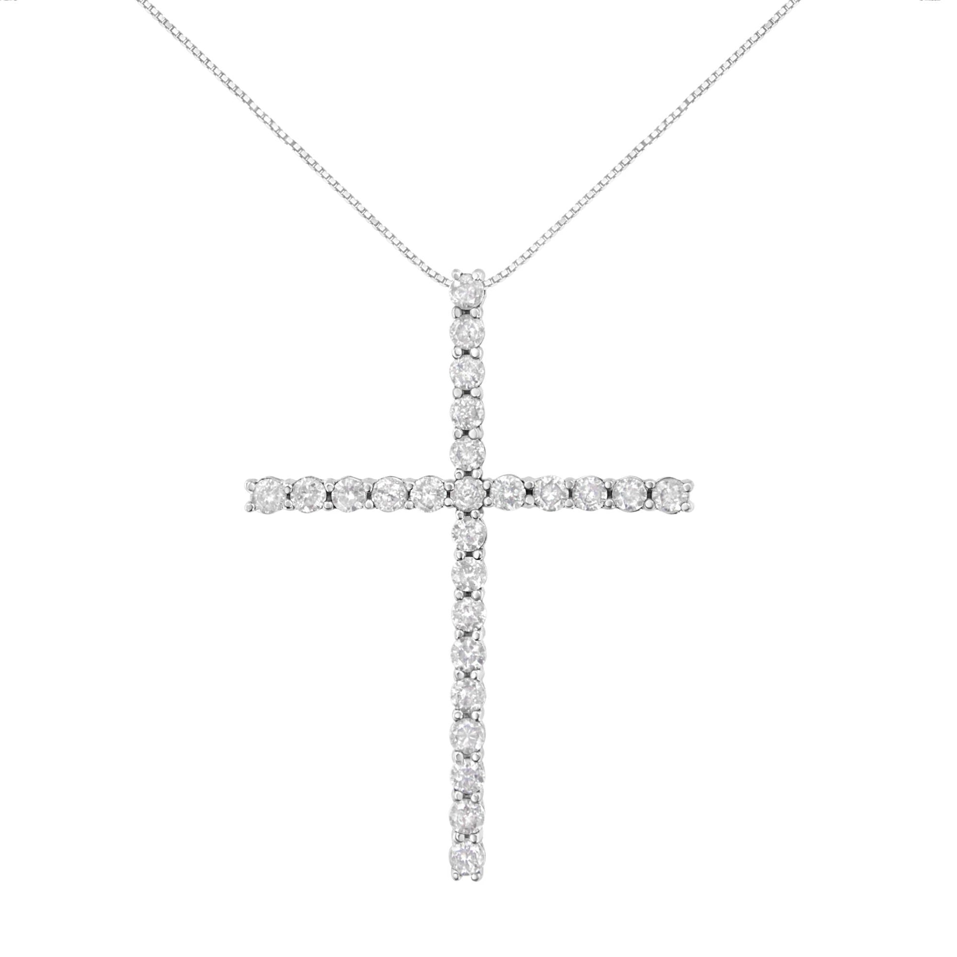 Front view of a white metal cross necklace pendant set with round white gemstones in prong settings on a chain.