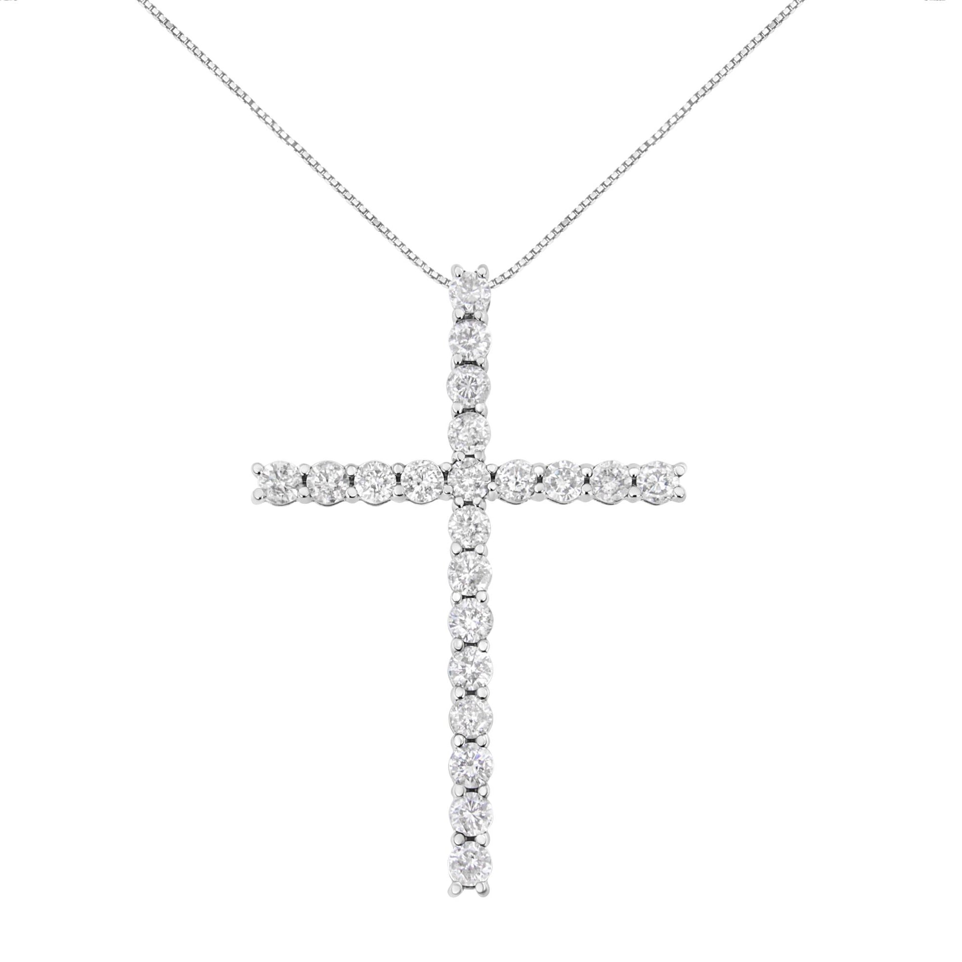 White metal cross-shaped necklace pendant with round white gemstones in prong settings, front-facing view.