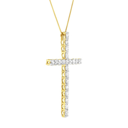 Yellow metal cross-shaped necklace pendant set with round white gemstones in prong settings, shown from a slight side angle.